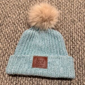 Love Your Melon blue knit beanie with a fur pom pom